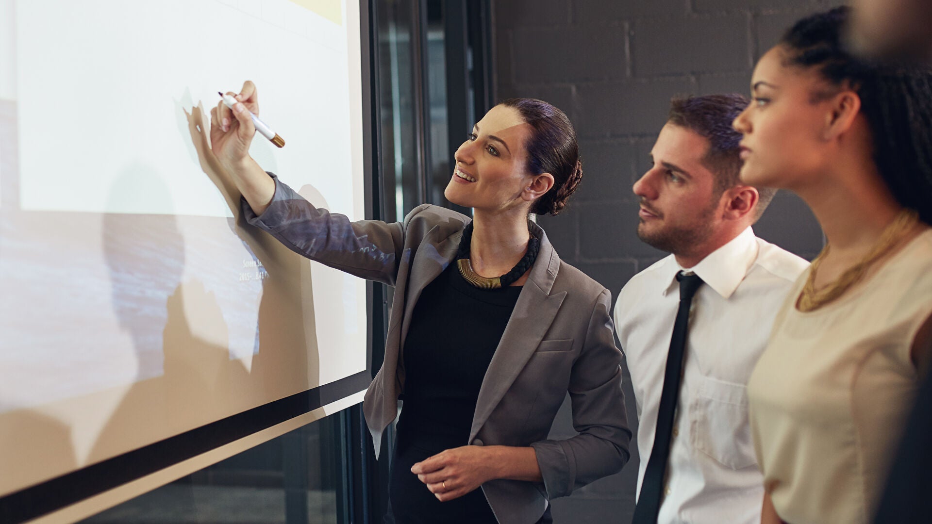 Commercial lawyers looking at screen together