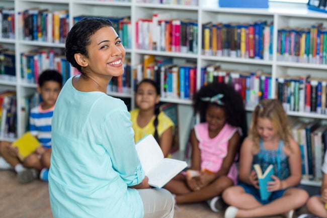 a diverse classroom with children from different backgrounds