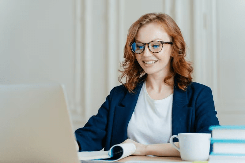 An Online MBA student studying on her laptop.