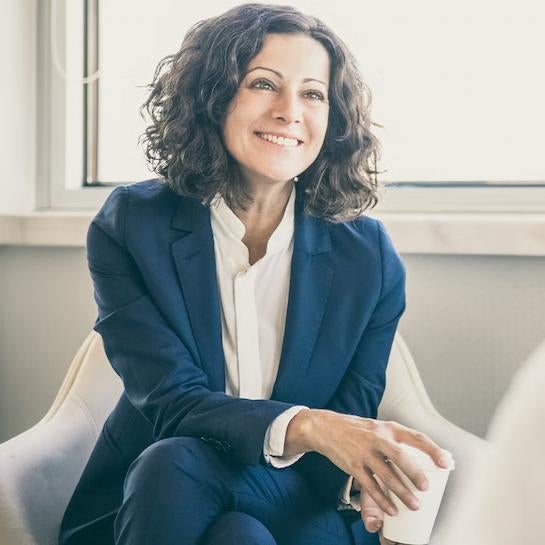 Accounting student smiling at someone out of frame