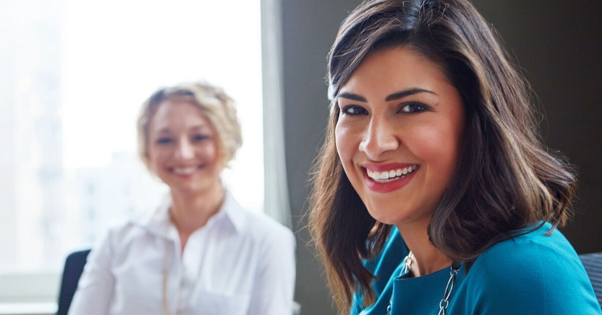 Portrait of two businesswomen having a meeting together in an office