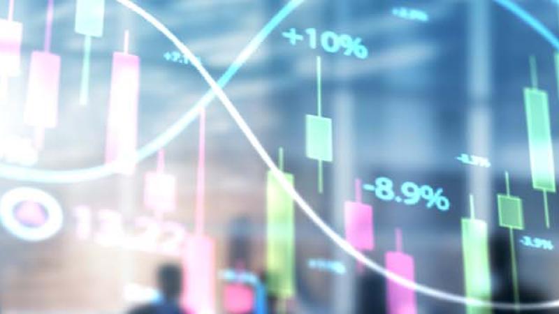 Business professionals analyzing a stock chart, discussing trends and strategies for investment decisions.