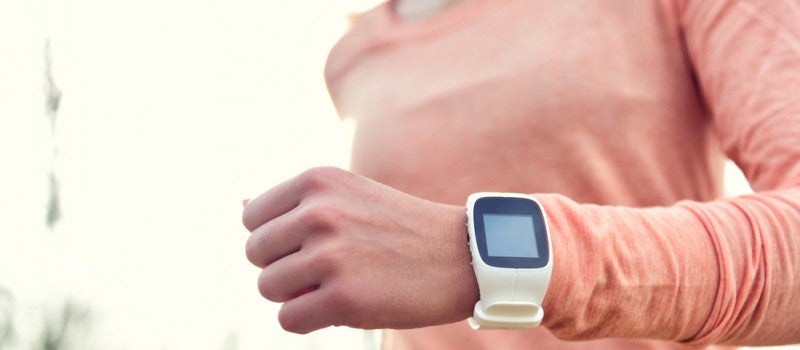 A woman wearing a smartwatch. 